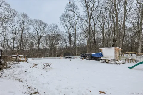 a kitchen with a refrigerator and a stove top oven