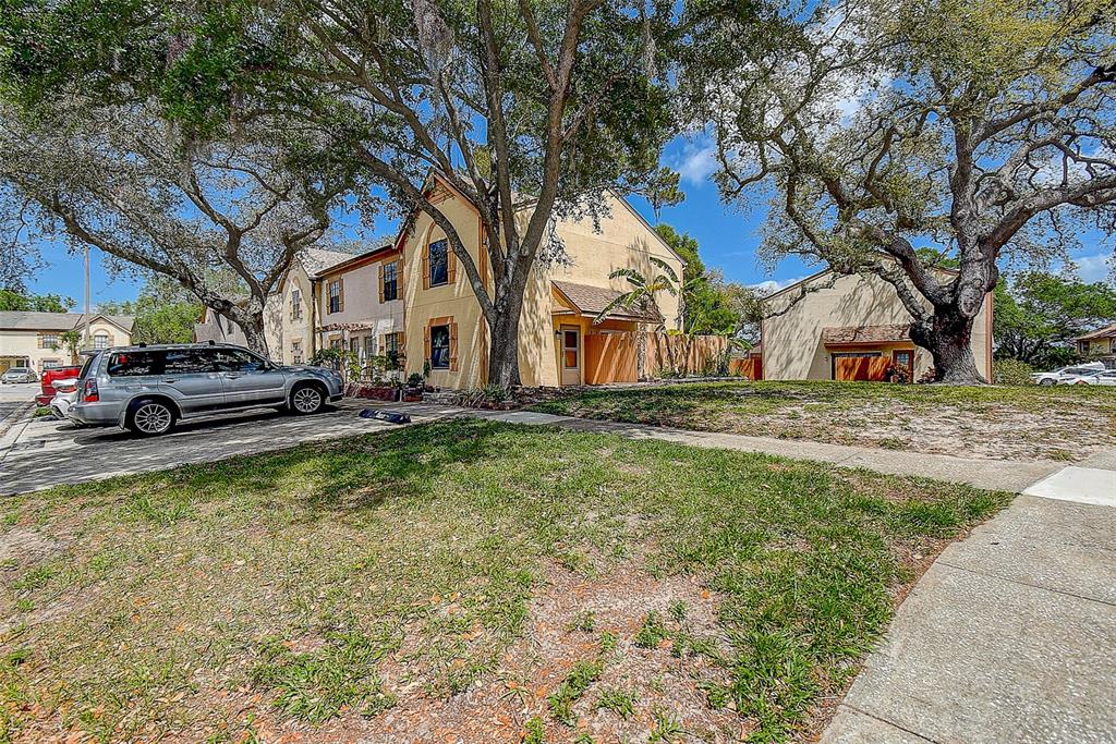 3604 Brigadoon Circle, Unit 3604 Clearwater, FL 33759 - Photo 1 of 1 a front view of a building with a yard
