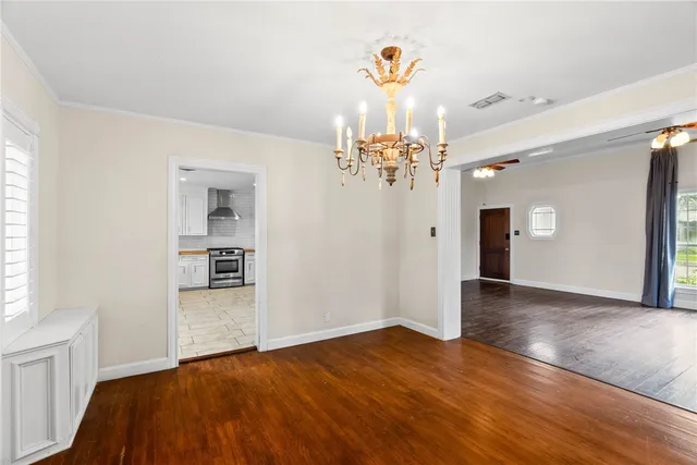 a view of a room with wooden floor & cabinet