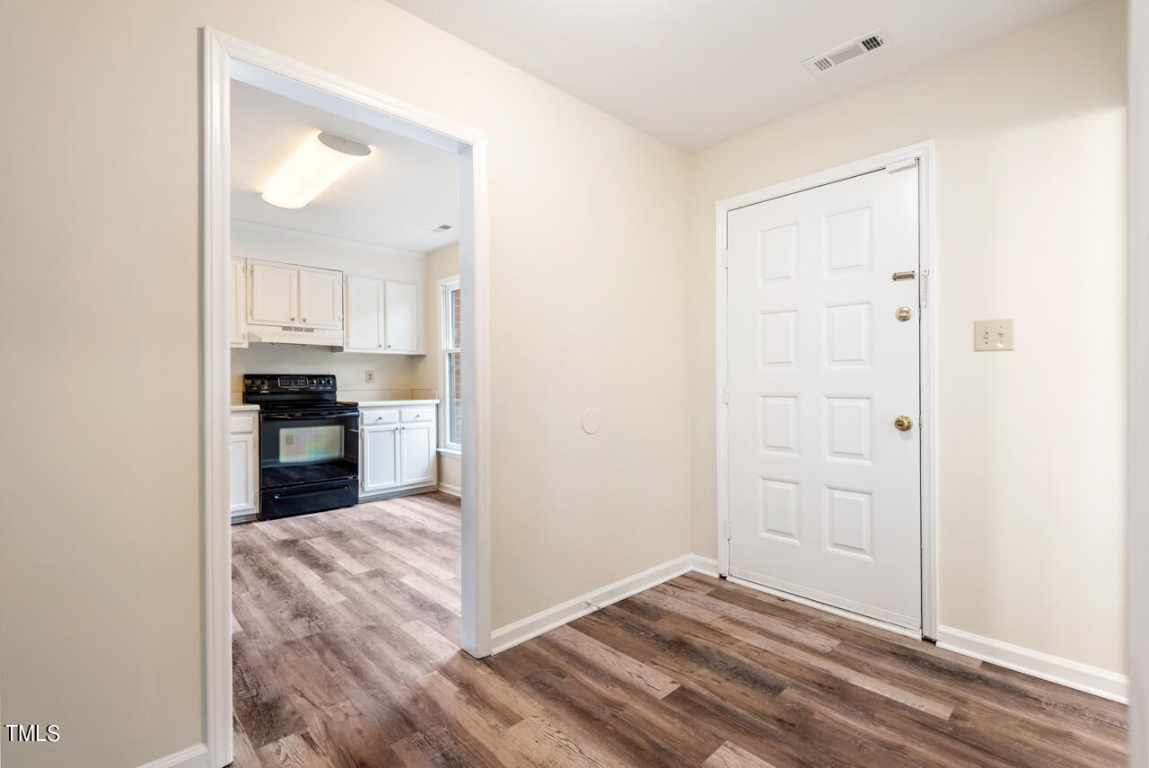 1501 Clermont Road, Unit T4 Durham, NC 27713 - Photo 3 of 29 a view of kitchen and wooden floor
