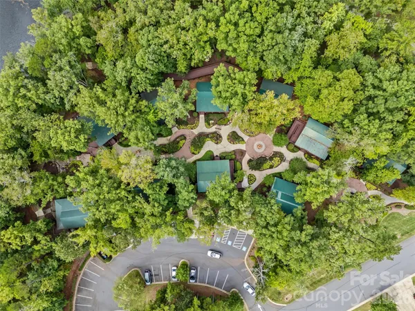 an aerial view of a pool patio swimming pool and outdoor seating