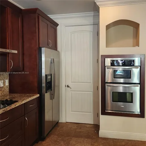 a view of an empty room with windows