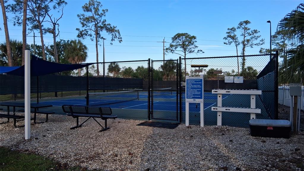 1300 State Rte 777, Unit W 86 Venice, FL 34293 - Photo 15 of 15 a view of a terrace with a bench