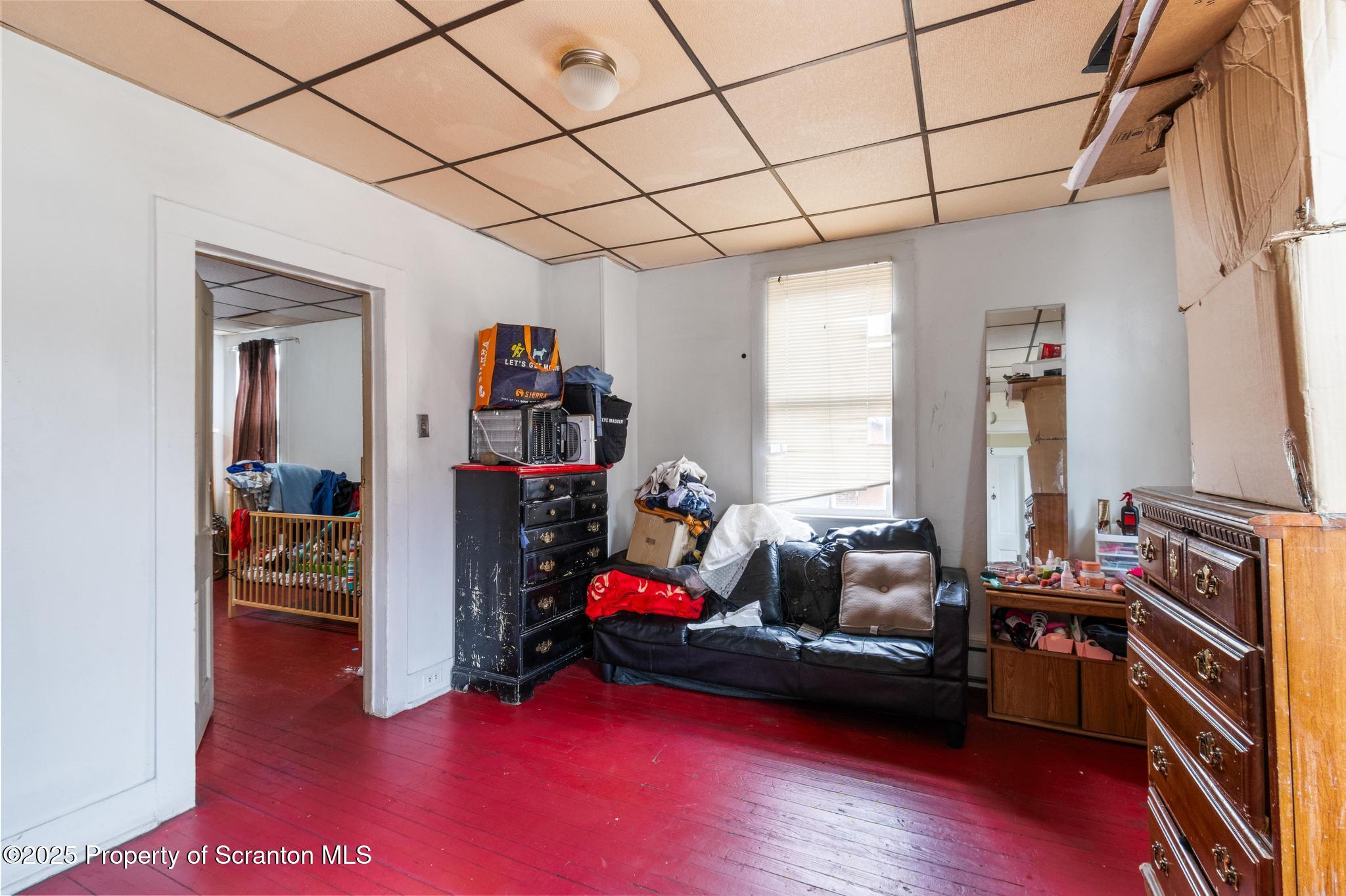 501-503 Cedar Avenue Scranton, PA 18505 - Photo 6 of 13 a living room with furniture and a wooden floor
