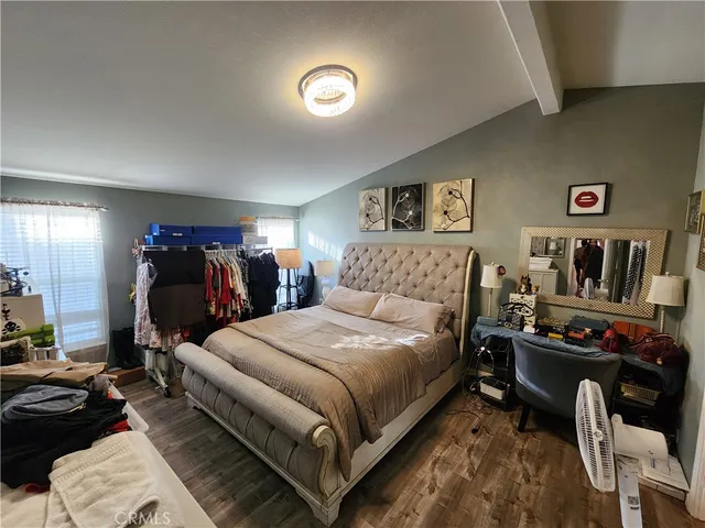 a bedroom with a bed and closet