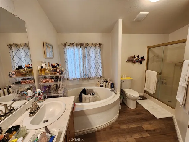 a white bath tub sitting next to a white toilet and sink