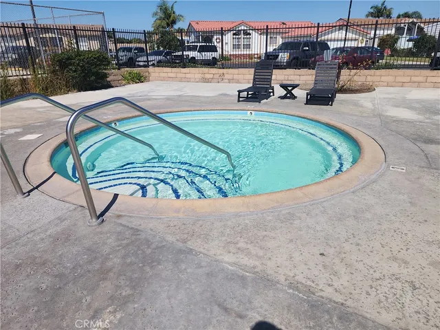 a view of a swimming pool with a lounge chair