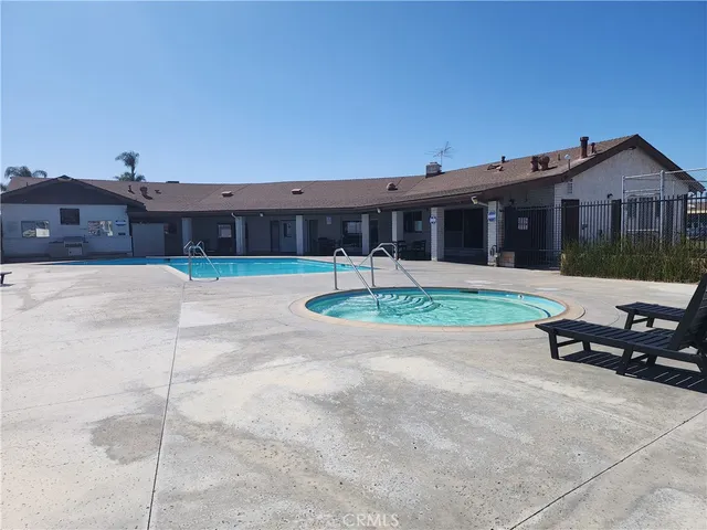 a view of a house with backyard and a garden