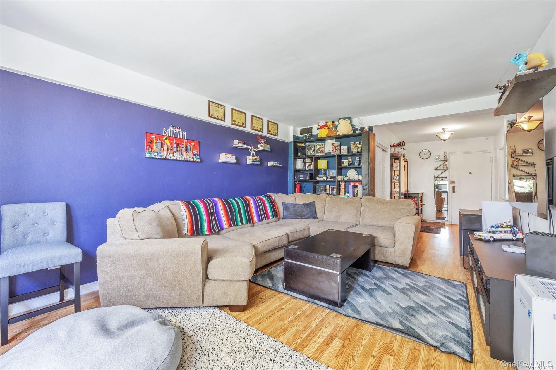 75-20 Bell Boulevard, Unit 5A Queens, NY 11364 - Photo 2 of 7 a living room with furniture and a rug