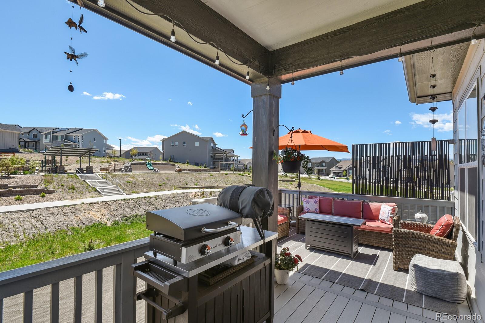 328 Simmental Loop Castle Rock, CO 80104 - Photo 16 of 20 a outdoor space with patio the couches and a potted plant