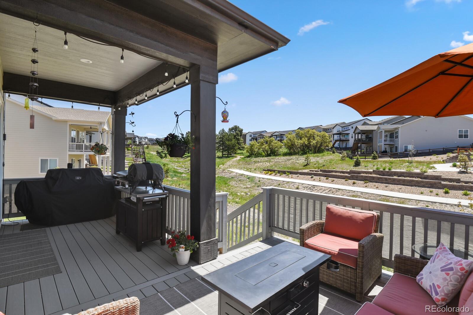 328 Simmental Loop Castle Rock, CO 80104 - Photo 17 of 20 a balcony with furniture and wooden floor