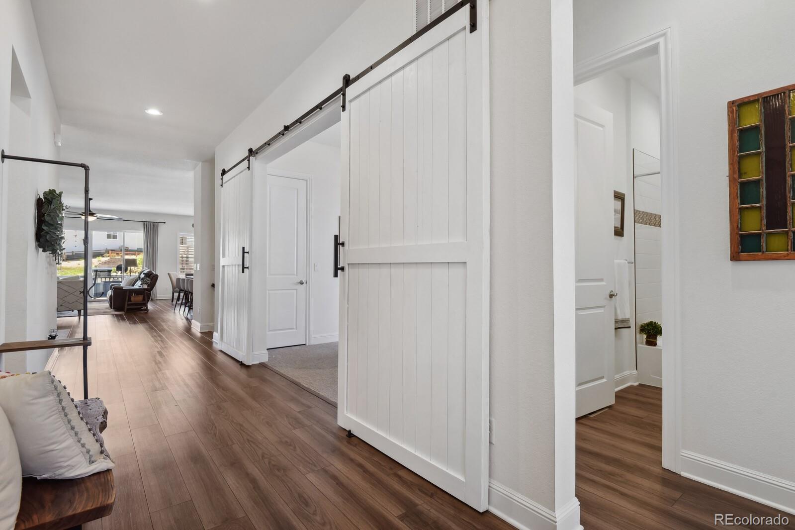 328 Simmental Loop Castle Rock, CO 80104 - Photo 2 of 20 a view of entryway with livingroom and wooden floor