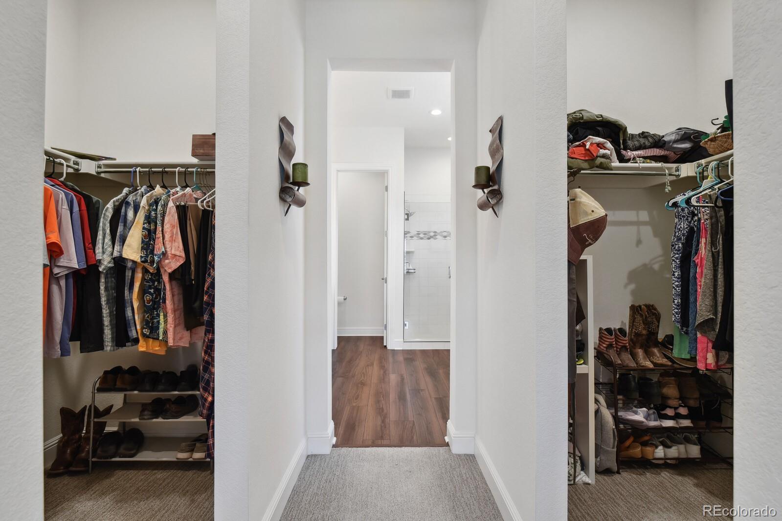 328 Simmental Loop Castle Rock, CO 80104 - Photo 10 of 20 a view of walk in closet with clothes and shoes