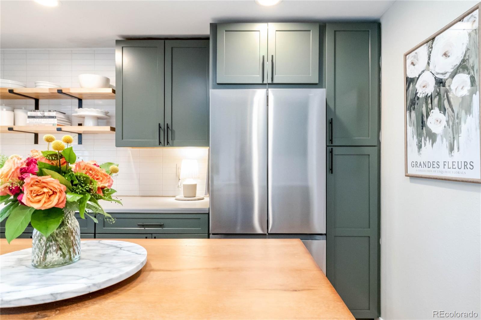 2701 Hooker Street Denver, CO 80211 - Photo 14 of 49 a kitchen with a refrigerator and a sink