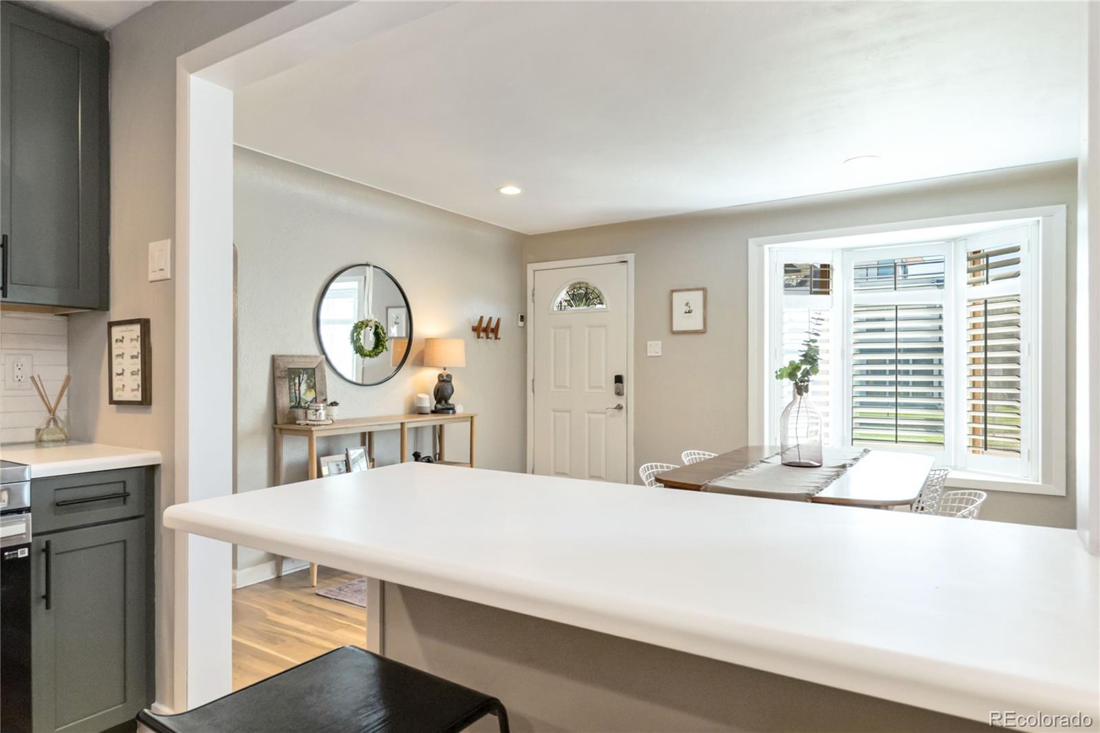 2701 Hooker Street Denver, CO 80211 - Photo 17 of 49 a bedroom with a bed a mirror and a window