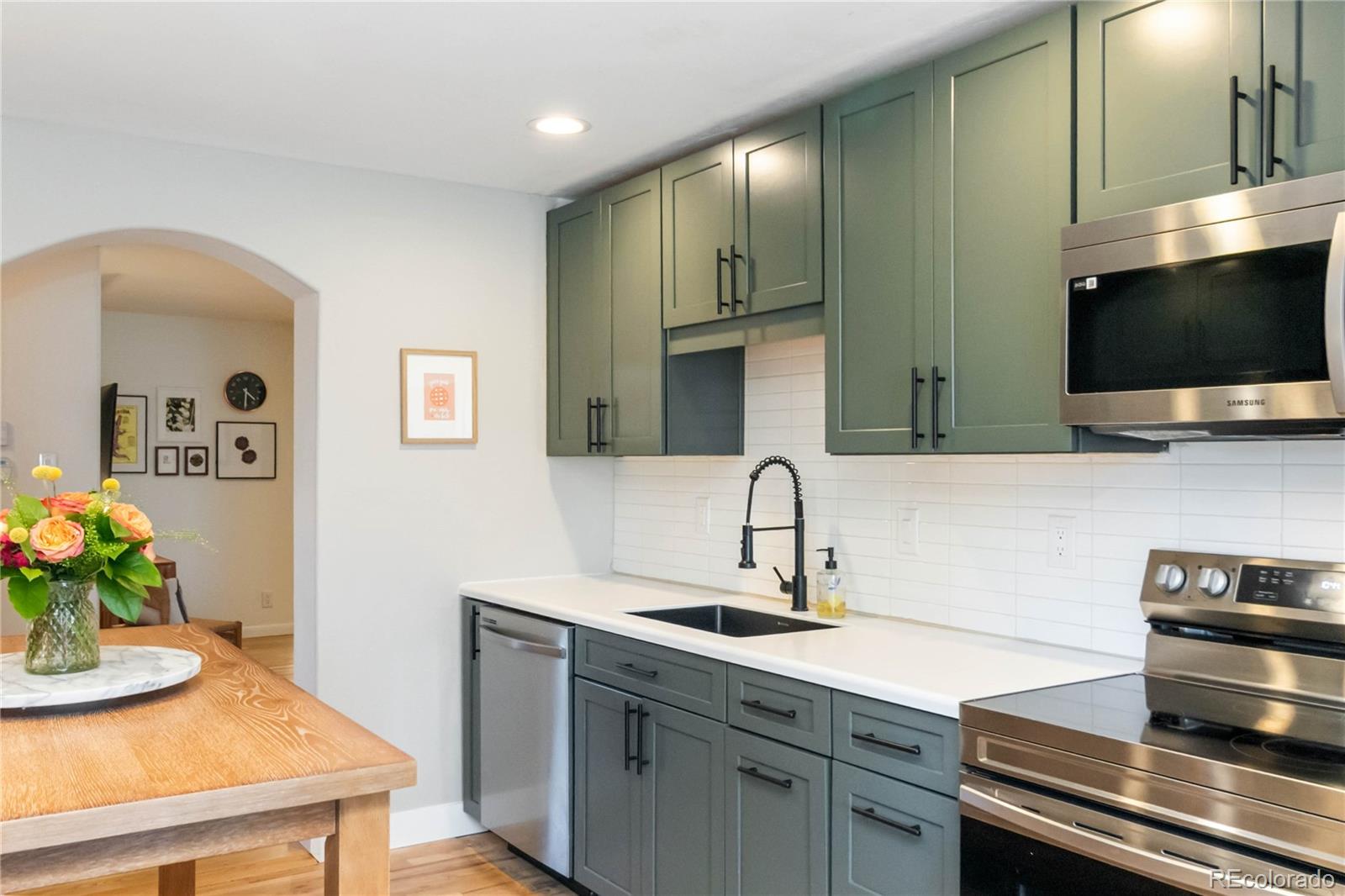 2701 Hooker Street Denver, CO 80211 - Photo 18 of 49 a kitchen with a sink and cabinets