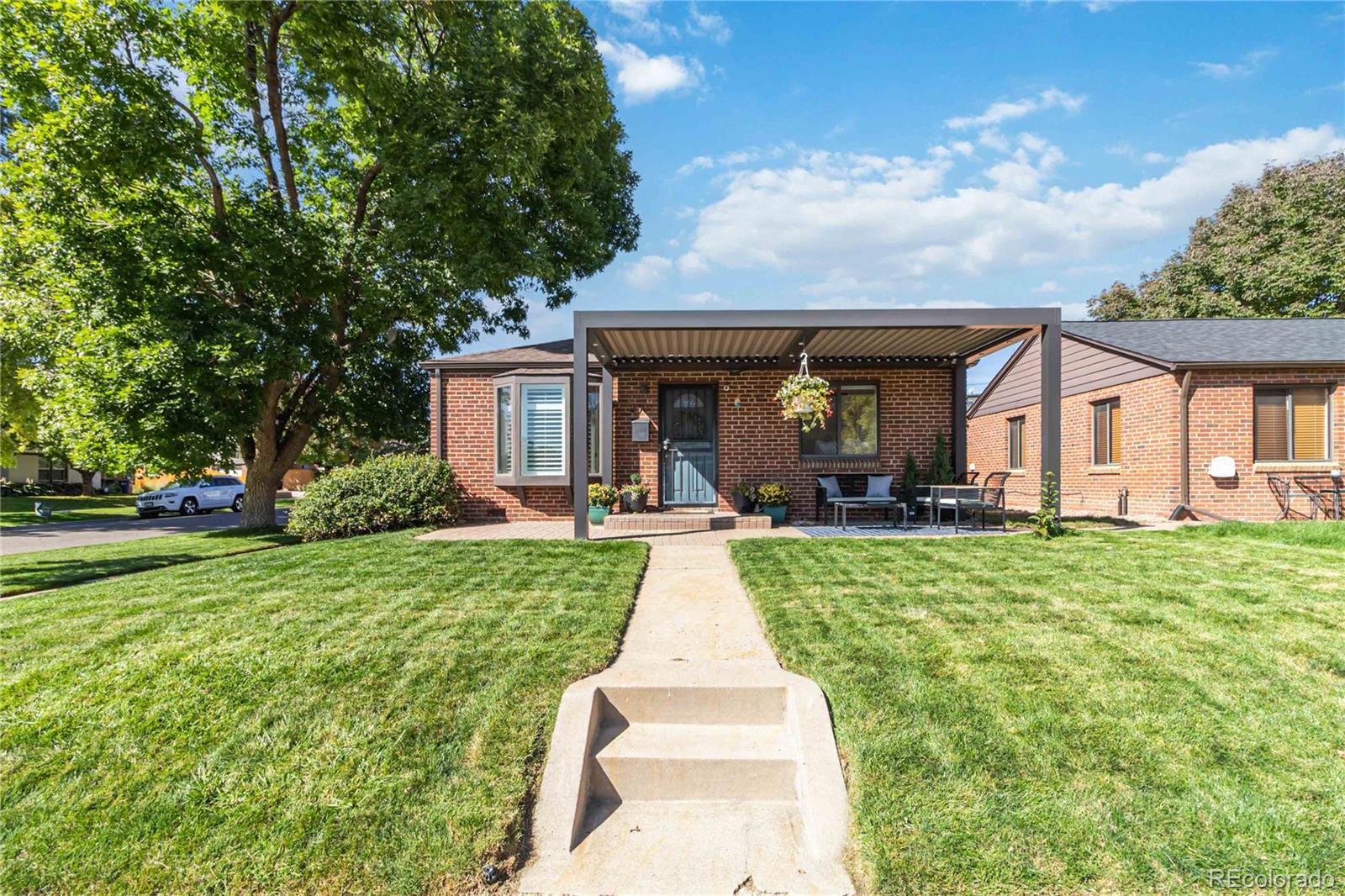 2701 Hooker Street Denver, CO 80211 - Photo 2 of 49 a front view of a house with yard patio and green space