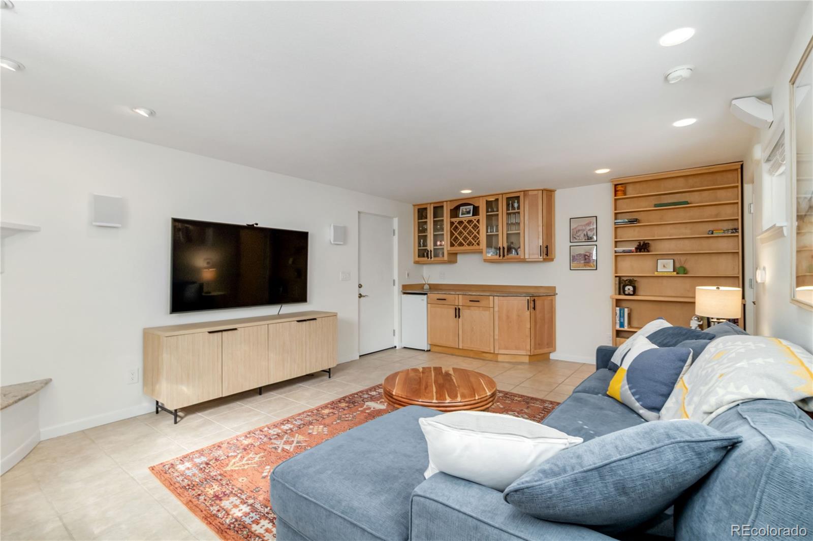2701 Hooker Street Denver, CO 80211 - Photo 27 of 49 a living room with furniture and a flat screen tv