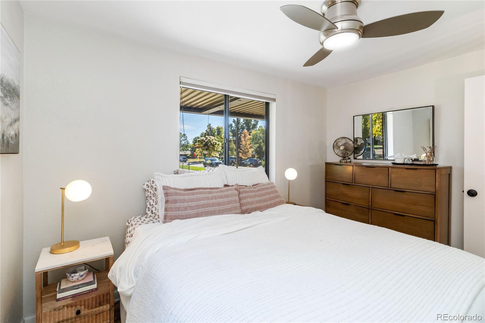 2701 Hooker Street Denver, CO 80211 - Photo 32 of 49 a bedroom with a bed and a dresser