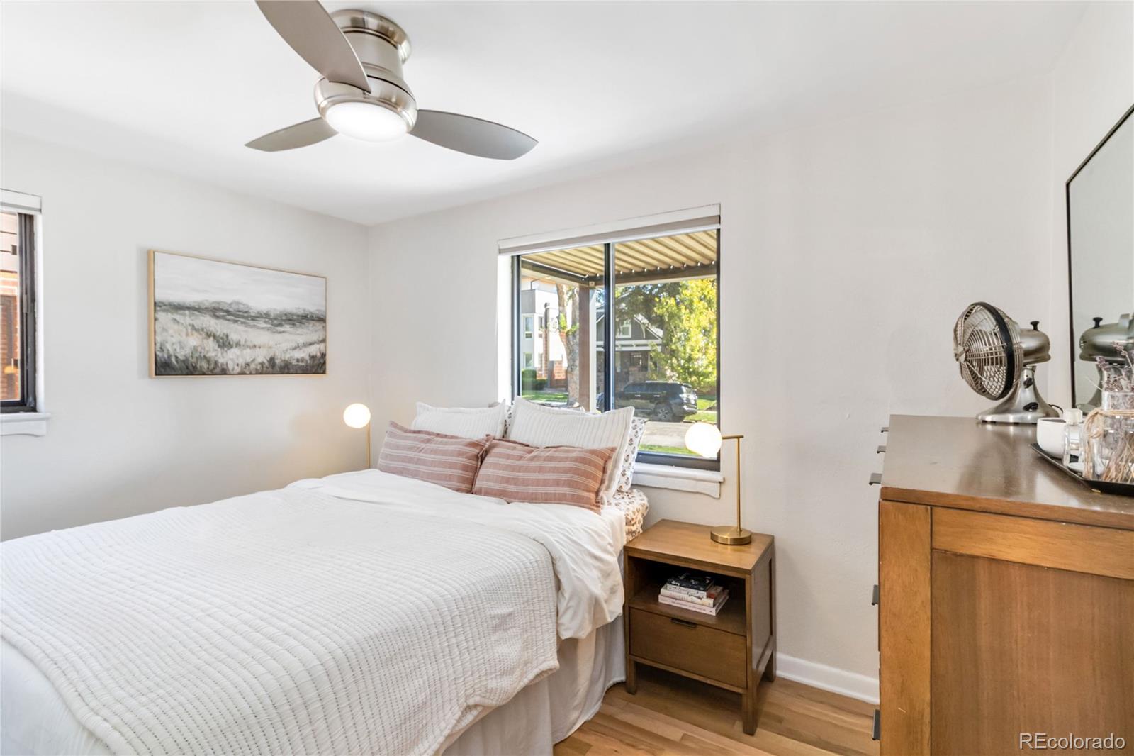 2701 Hooker Street Denver, CO 80211 - Photo 33 of 49 a bedroom with a bed and wooden floor