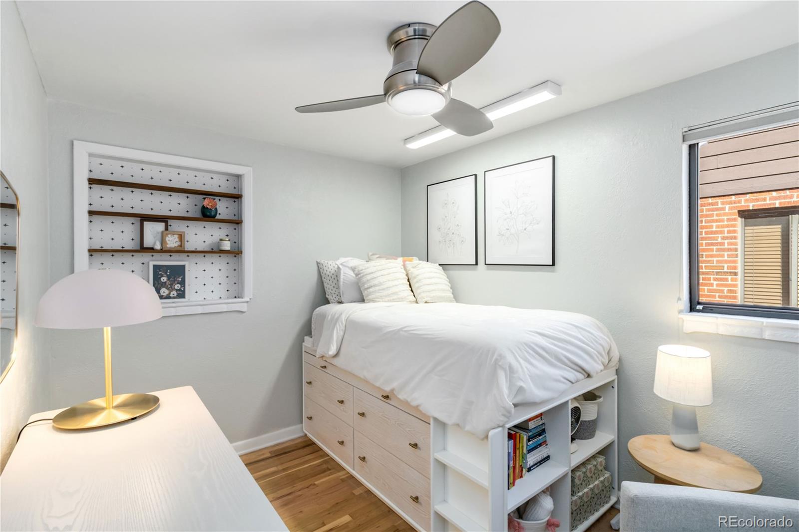 2701 Hooker Street Denver, CO 80211 - Photo 34 of 49 a bedroom with a bed and a lamp