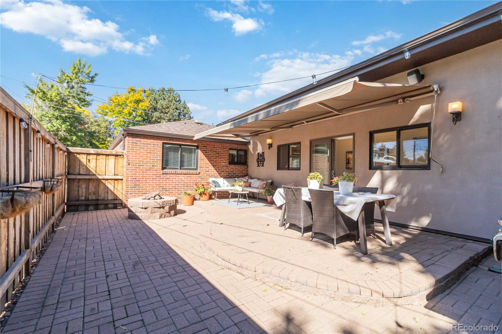 2701 Hooker Street Denver, CO 80211 - Photo 39 of 49 a view of a patio with table and chairs and potted plants