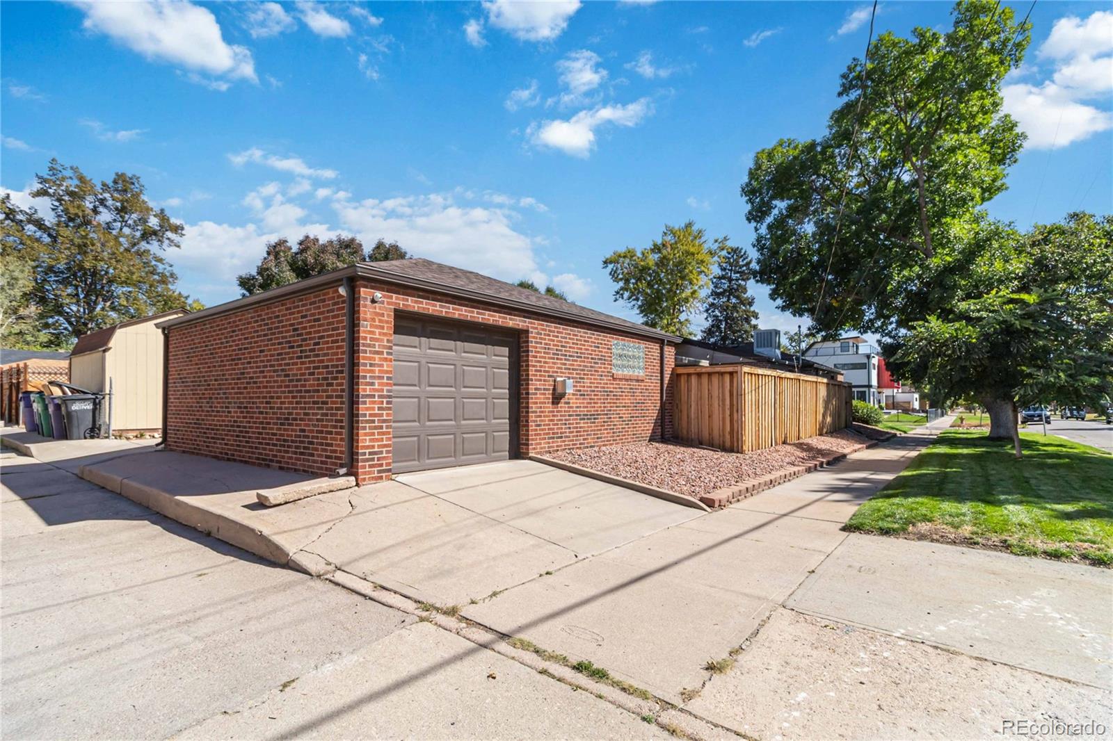 2701 Hooker Street Denver, CO 80211 - Photo 45 of 49 a front view of a house with a yard and garage