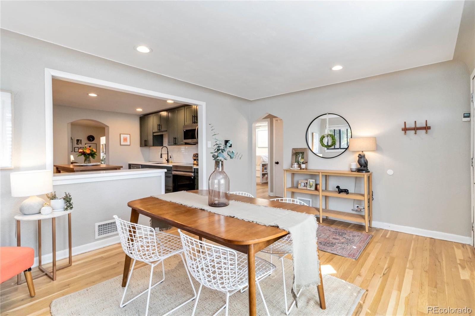 2701 Hooker Street Denver, CO 80211 - Photo 10 of 49 a view of a dining room with furniture and a clock