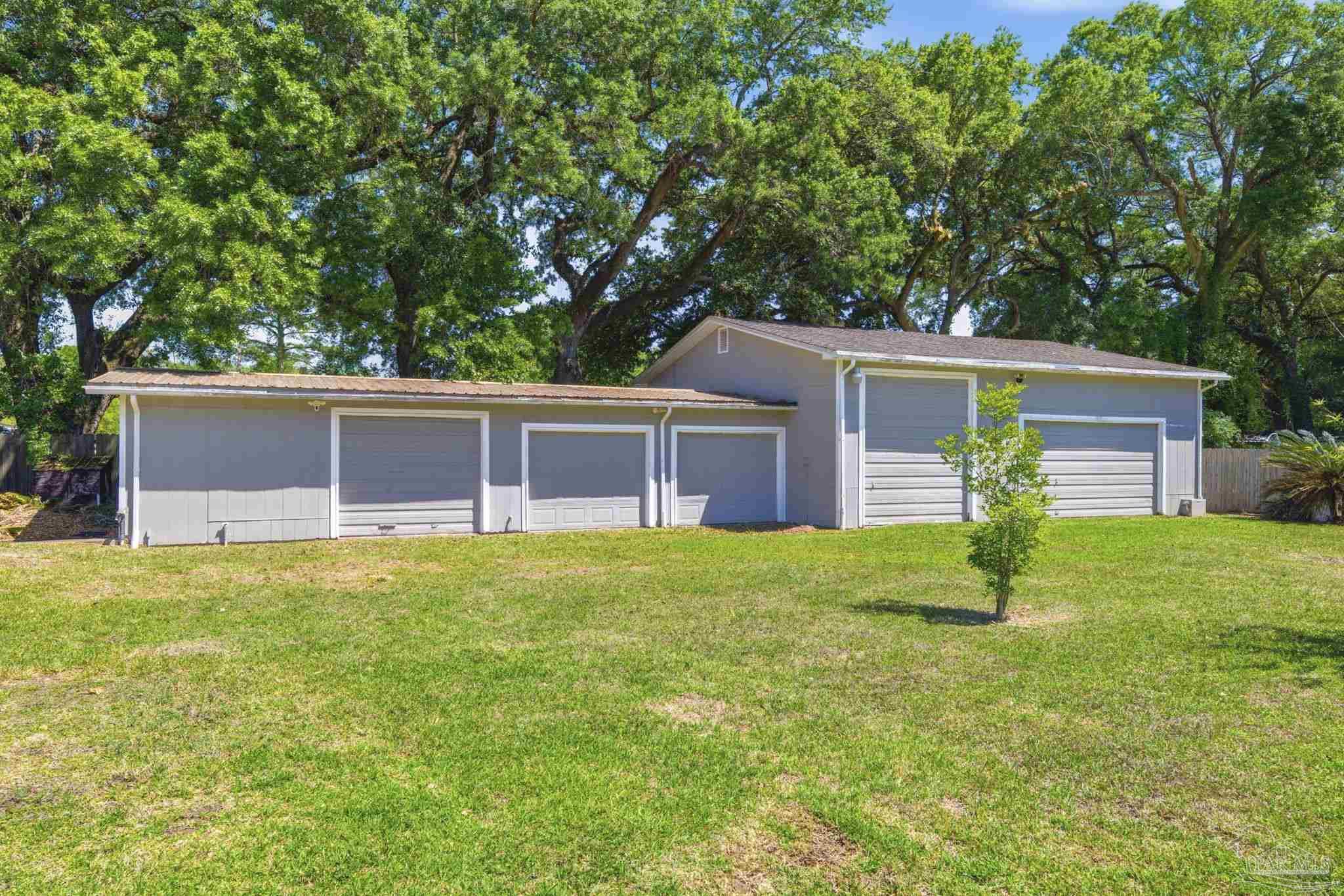 4552 Peaden Road Pace, FL 32571 - Photo 42 of 43 RV garage + one car has 1/2 bath too!