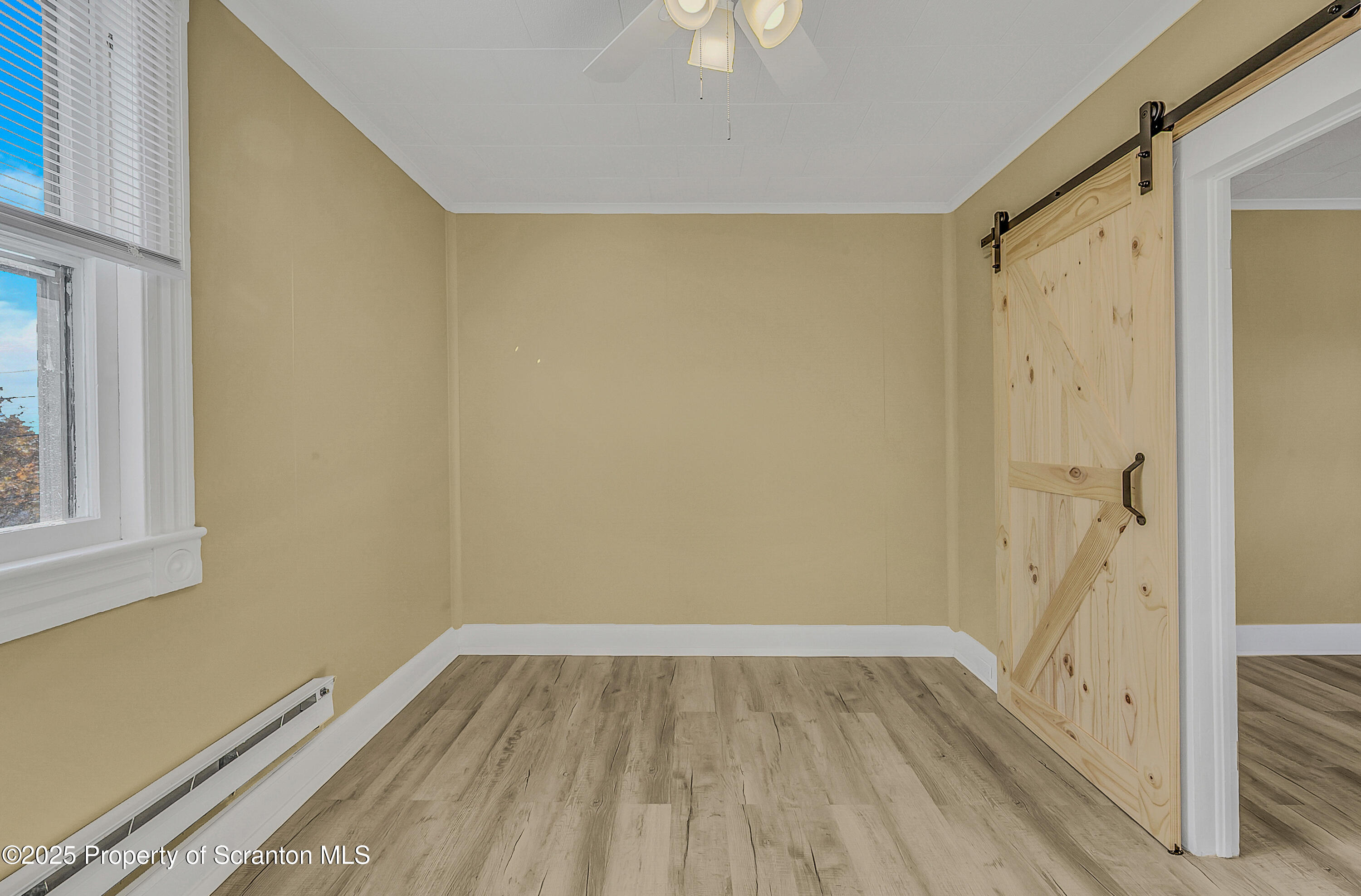 864 South Main Street, Unit 4 Old Forge, PA 18518 - Photo 12 of 17 a view of a room with wooden floor and a window
