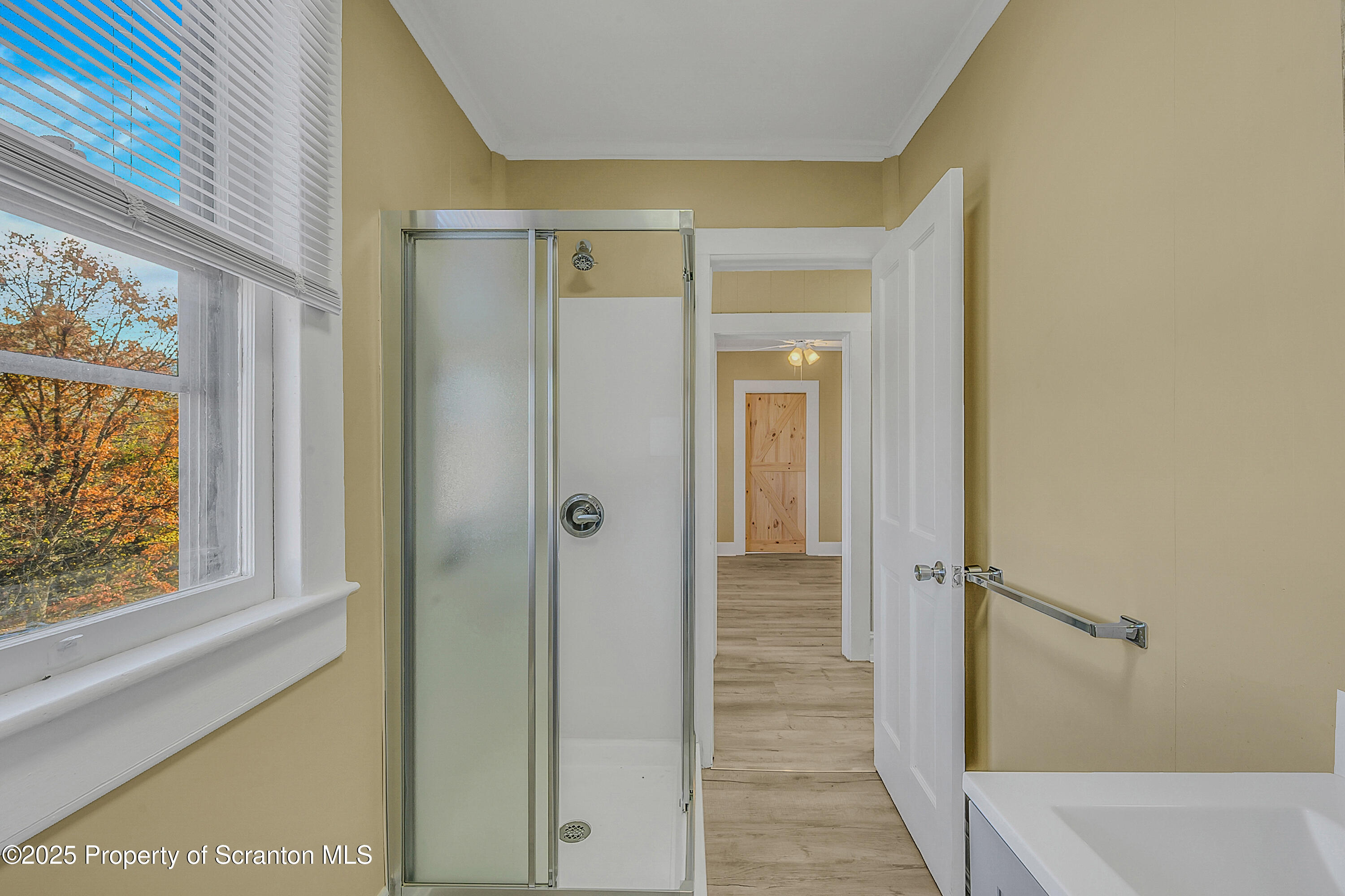 864 South Main Street, Unit 4 Old Forge, PA 18518 - Photo 15 of 17 a view of a bathroom with a glass door
