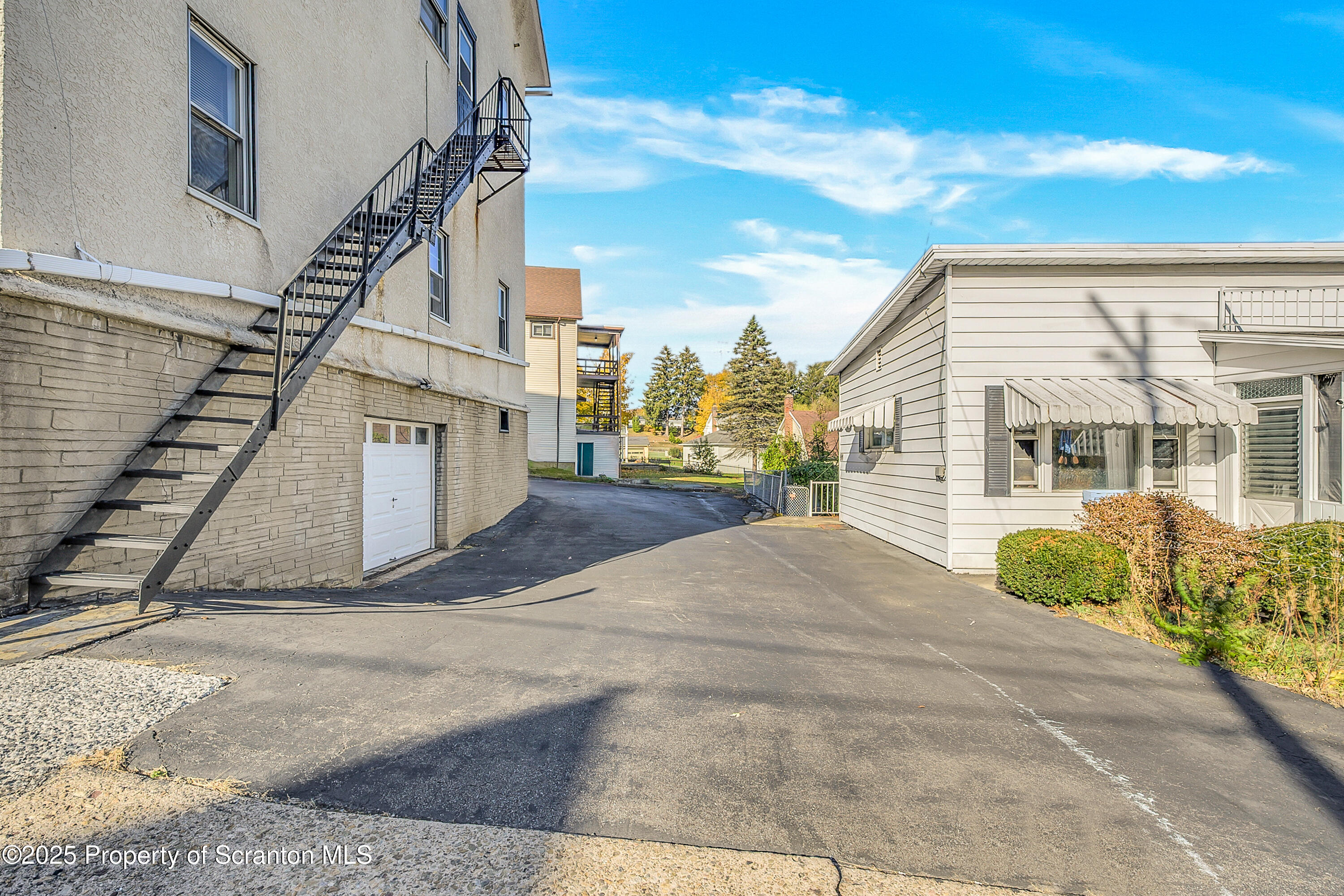 864 South Main Street, Unit 4 Old Forge, PA 18518 - Photo 17 of 17 a front view of a house with a garden
