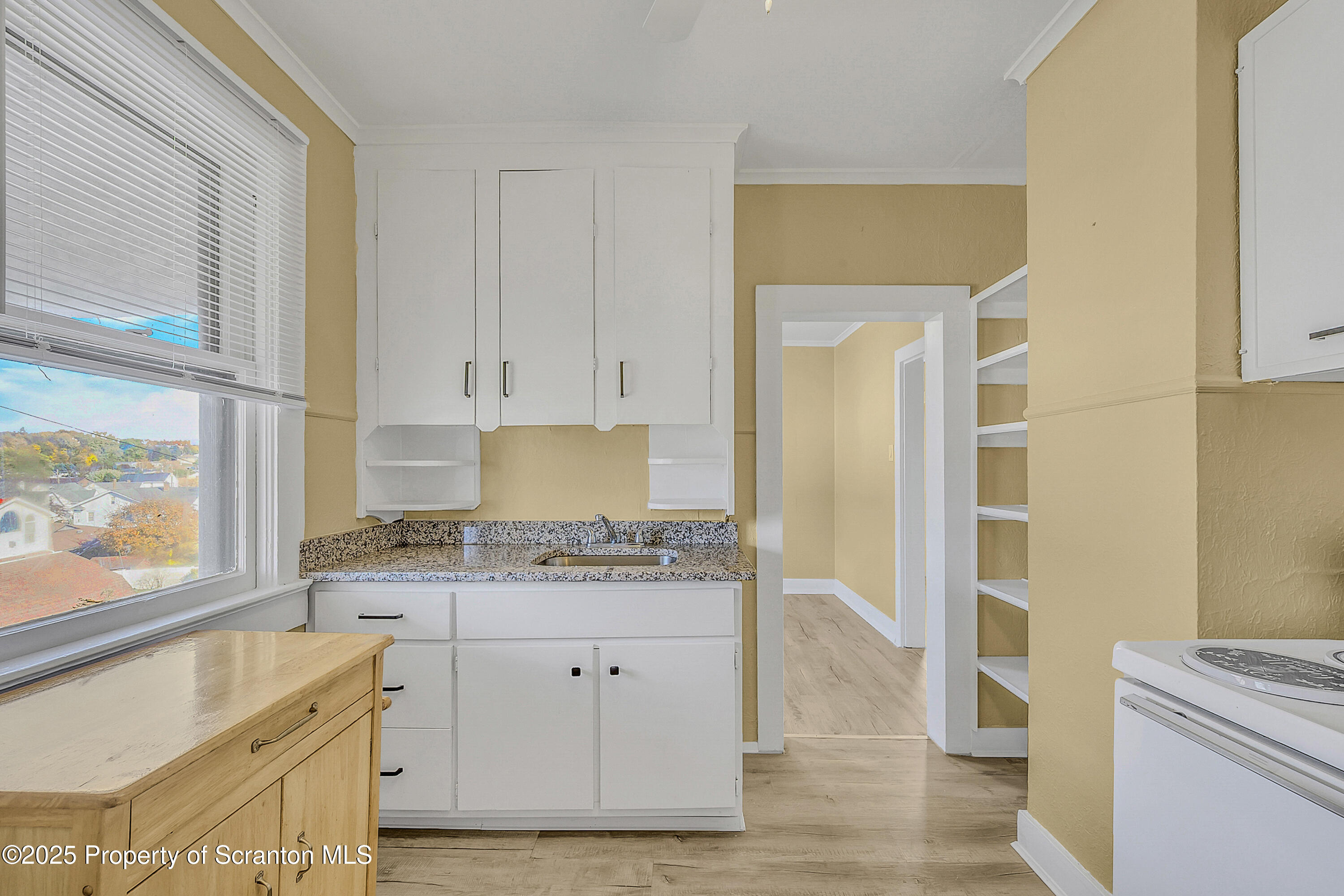 864 South Main Street, Unit 4 Old Forge, PA 18518 - Photo 3 of 17 a kitchen with a stove a sink and a refrigerator