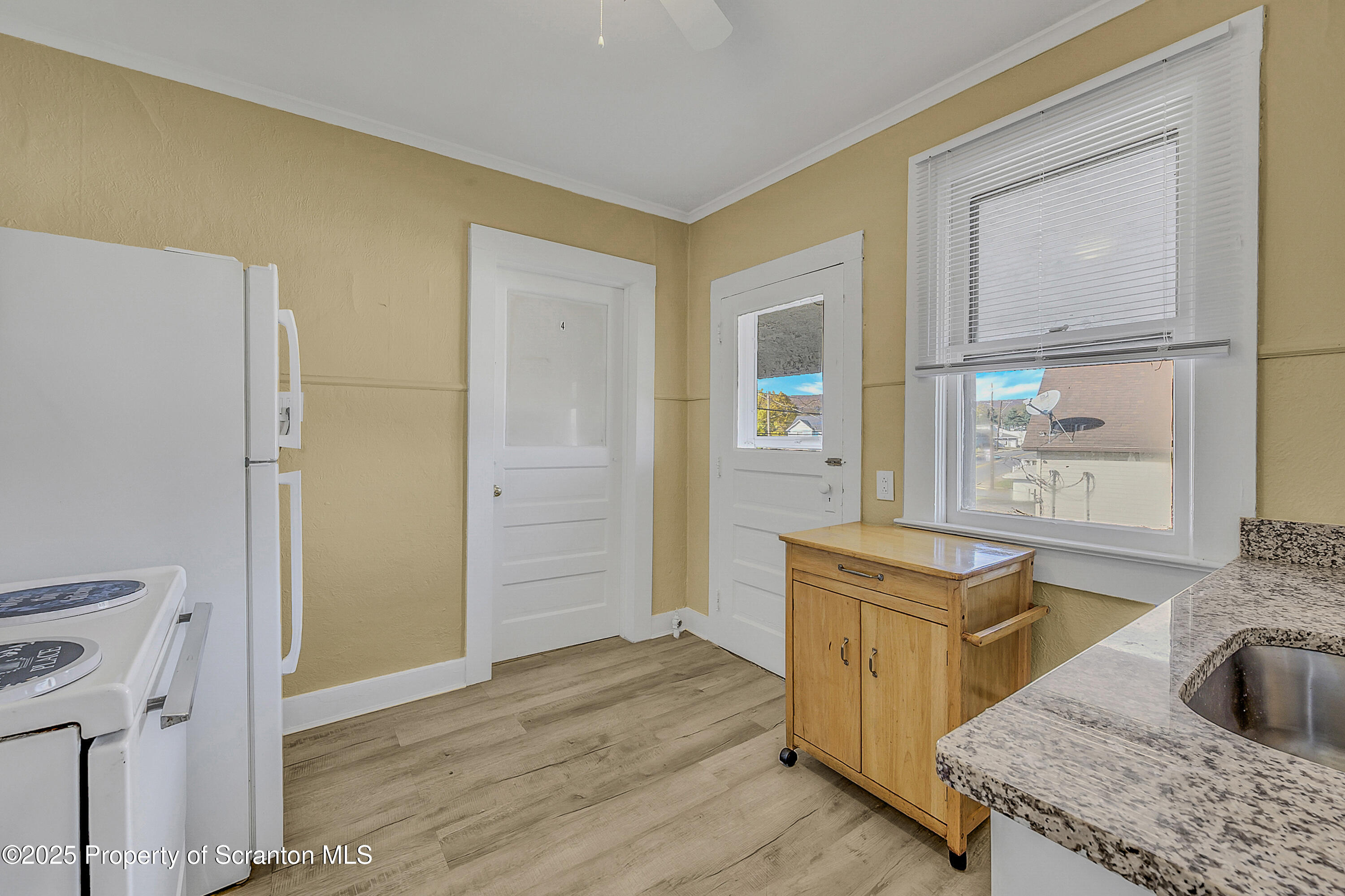 864 South Main Street, Unit 4 Old Forge, PA 18518 - Photo 4 of 17 a kitchen with a sink and a refrigerator