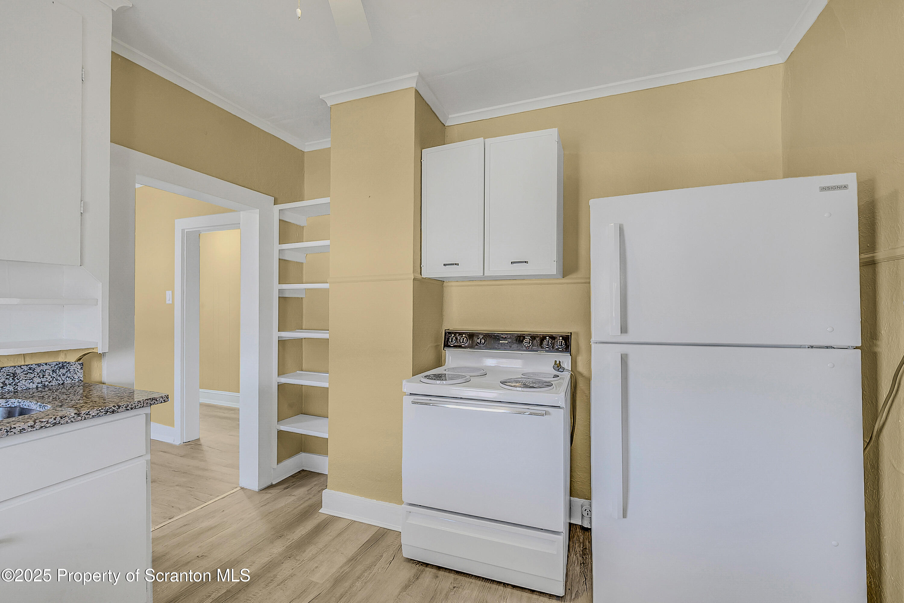 864 South Main Street, Unit 4 Old Forge, PA 18518 - Photo 5 of 17 a white refrigerator freezer and a stove sitting inside of a kitchen