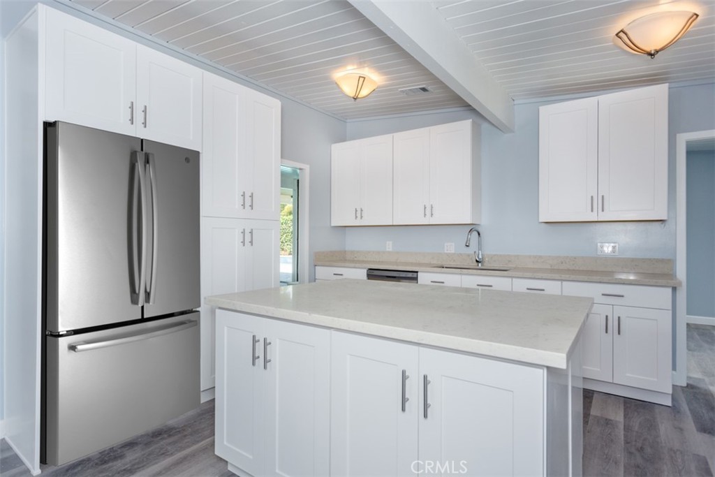 1747 North Shaffer Street Orange, CA 92865 - Photo 21 of 35 a kitchen with appliances a refrigerator and a sink