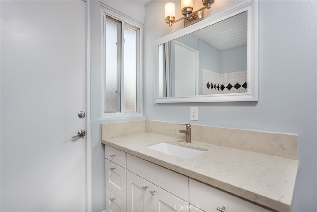1747 North Shaffer Street Orange, CA 92865 - Photo 27 of 35 a bathroom with a sink and a mirror