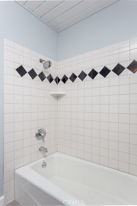 1747 North Shaffer Street Orange, CA 92865 - Photo 28 of 35 a bathroom with a bathtub and shower curtain