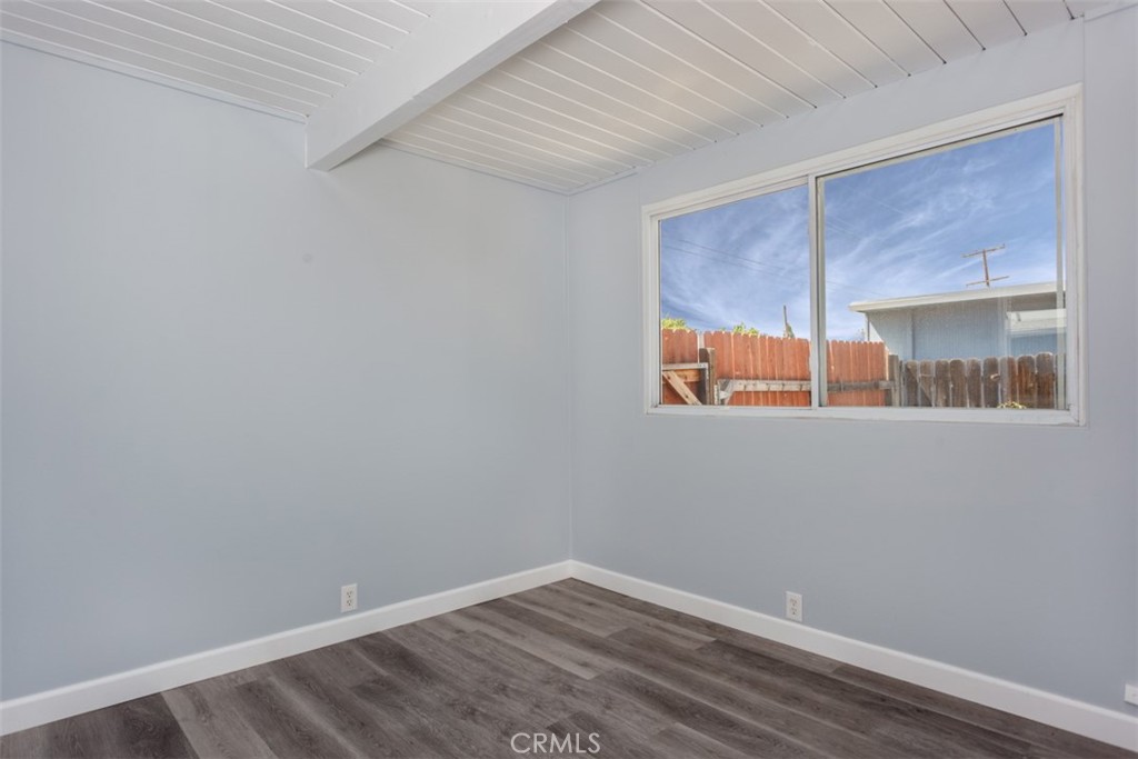 1747 North Shaffer Street Orange, CA 92865 - Photo 29 of 35 a view of an empty room with wooden floor and a window