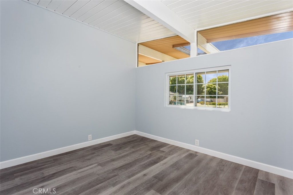 1747 North Shaffer Street Orange, CA 92865 - Photo 30 of 35 a view of an empty room with wooden floor and a window