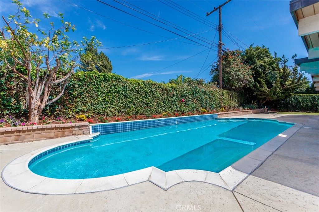 1747 North Shaffer Street Orange, CA 92865 - Photo 35 of 35 a view of a swimming pool with a yard