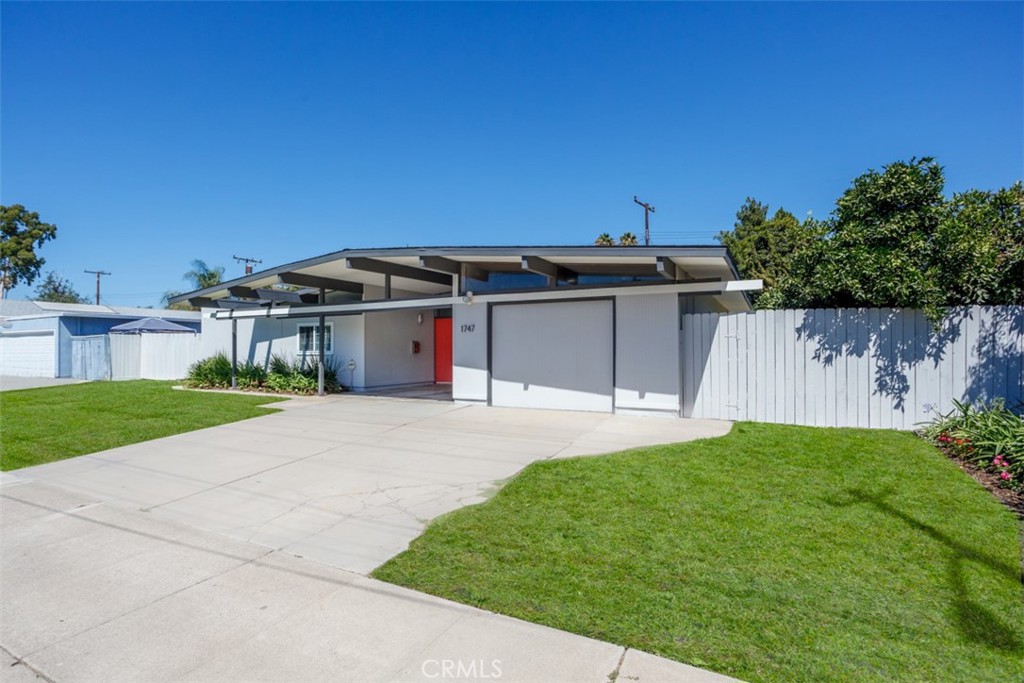 1747 North Shaffer Street Orange, CA 92865 - Photo 4 of 35 a view of a house with a yard and a large tree