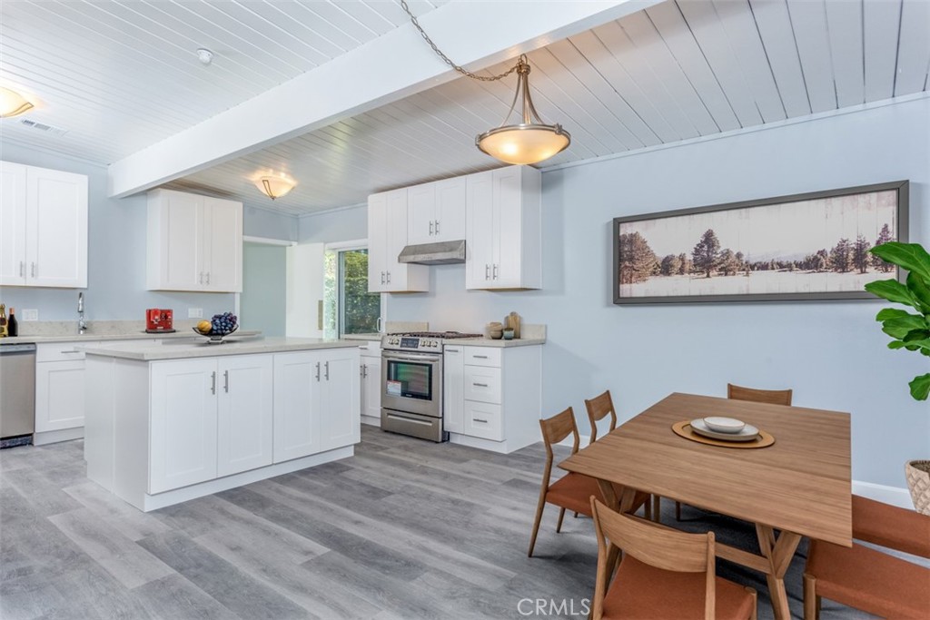 1747 North Shaffer Street Orange, CA 92865 - Photo 7 of 35 a kitchen with white cabinets stove and white appliances