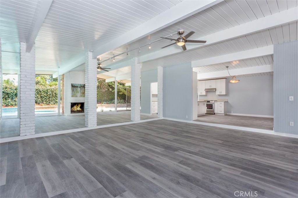 1747 North Shaffer Street Orange, CA 92865 - Photo 9 of 35 a view of an empty room with wooden floor and a fireplace