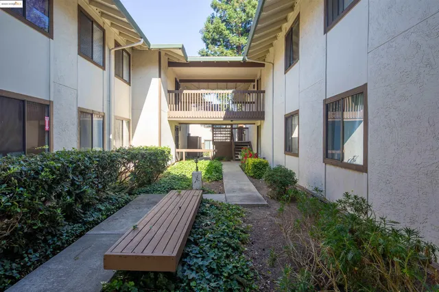 a view of a brick house with a yard
