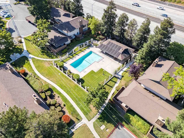 an aerial view of a house with a ocean view