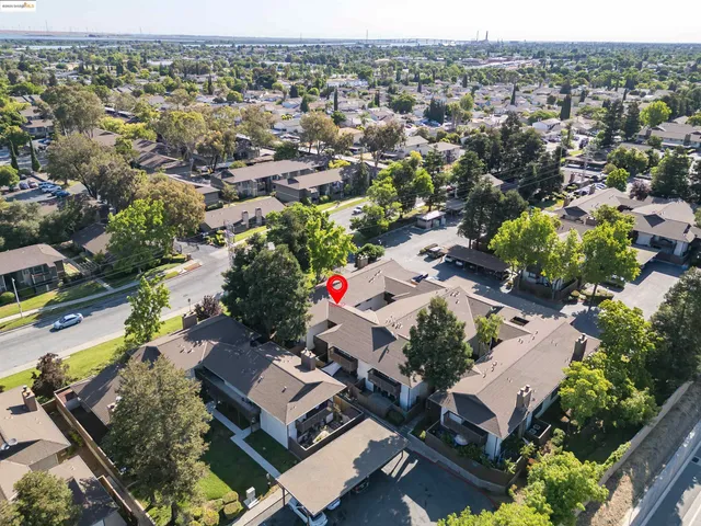 an aerial view of residential houses with outdoor space