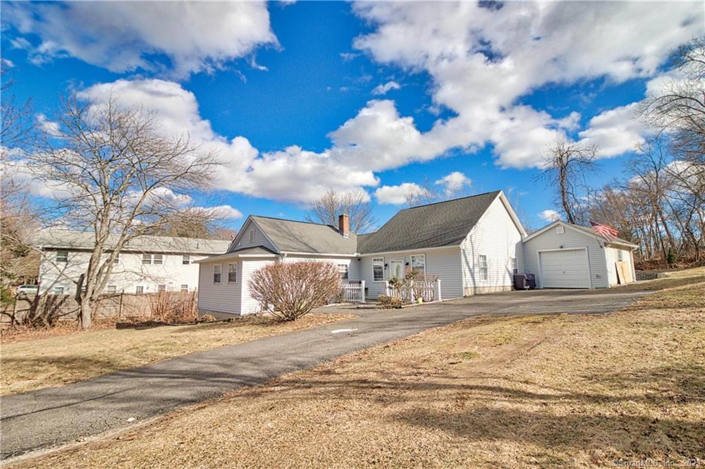 a view of a house with a snow on the road