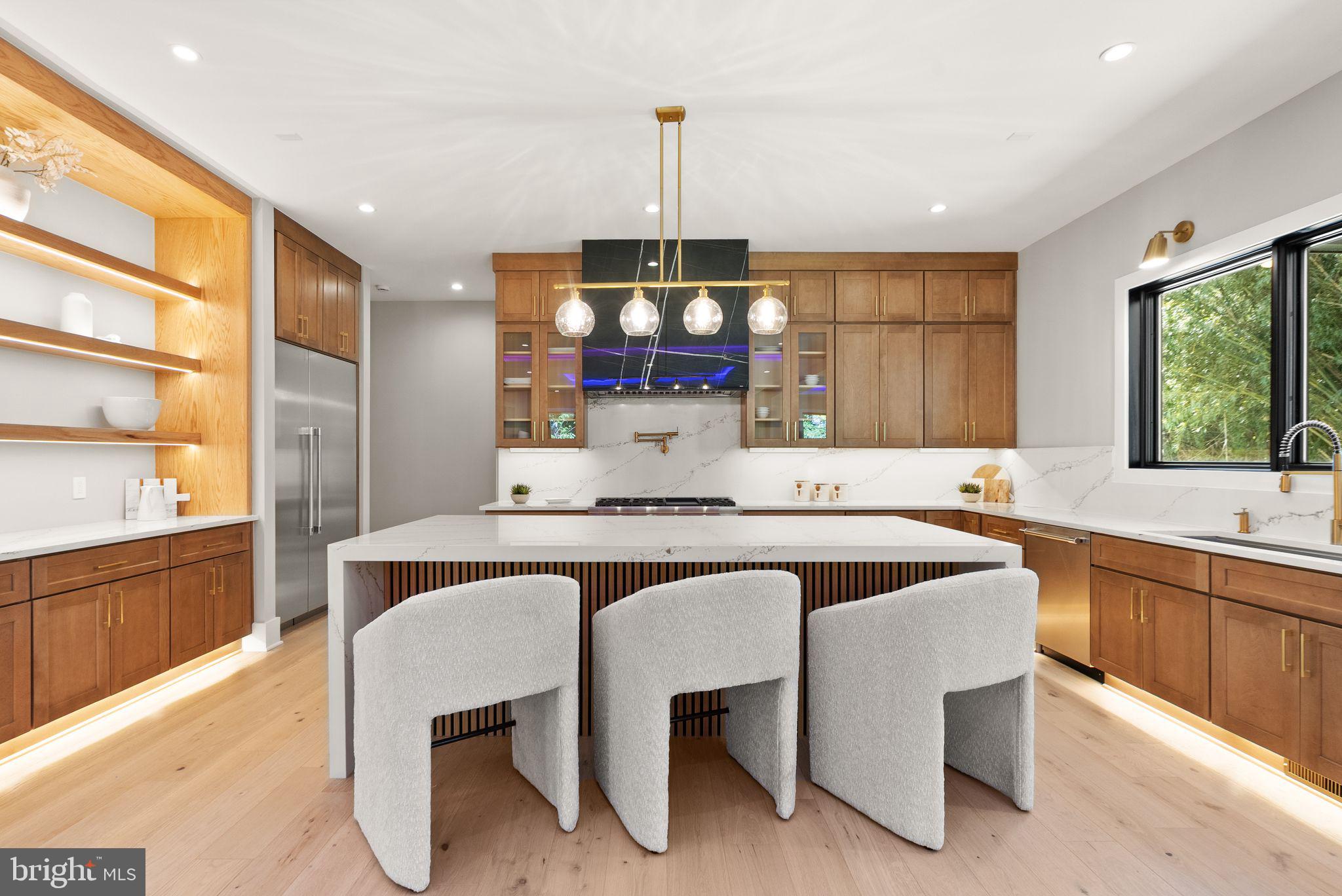 6329 Halsey Road McLean, VA 22101 - Photo 19 of 94 Sleek modern kitchen with warm tones.