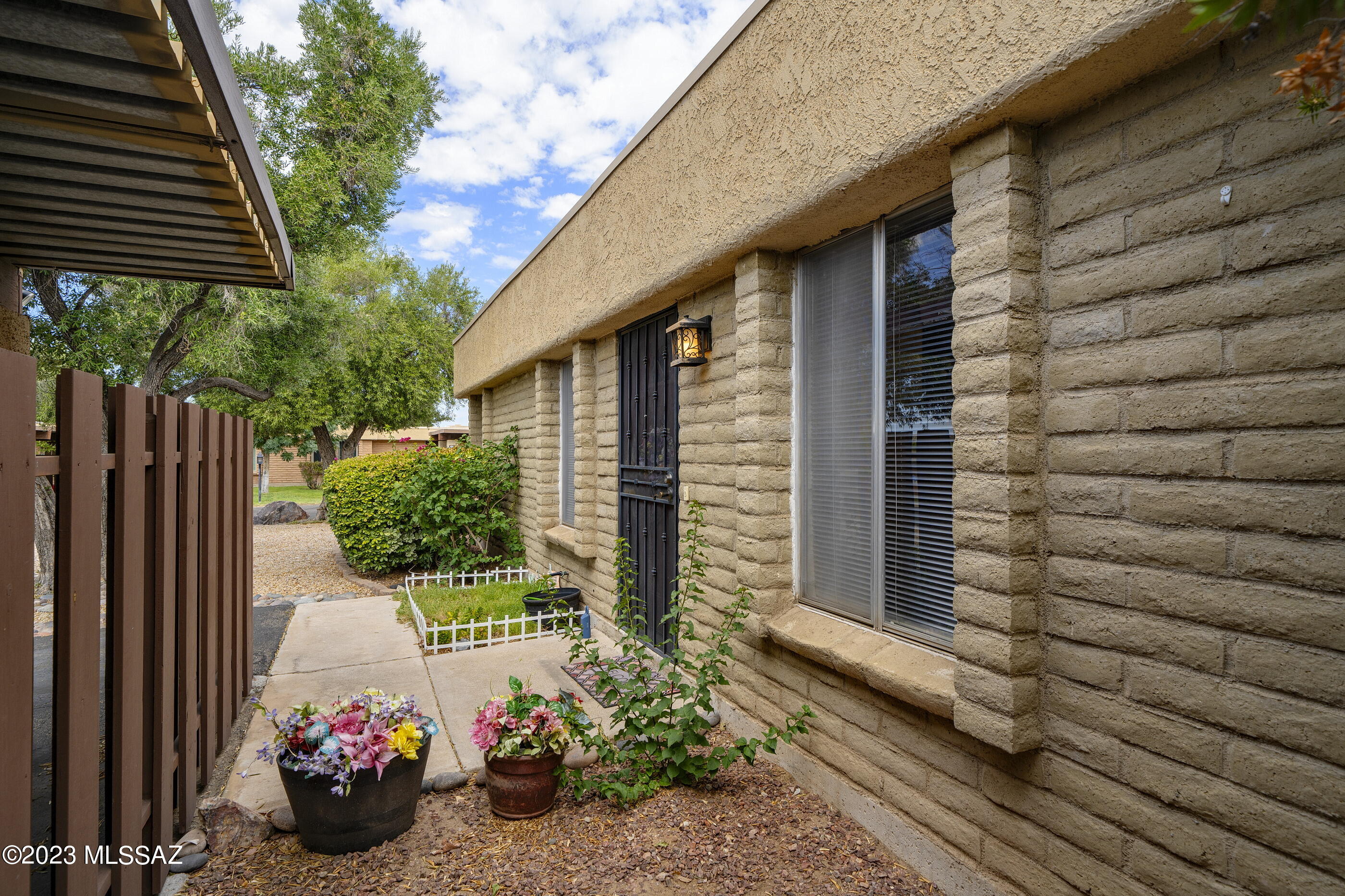 670 South Pantano Road, Unit E Tucson, AZ 85710 - Photo 3 of 17 a view of a house with a backyard and sitting area